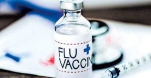 Elderly person receiving flu vaccine in hospital to prevent infections