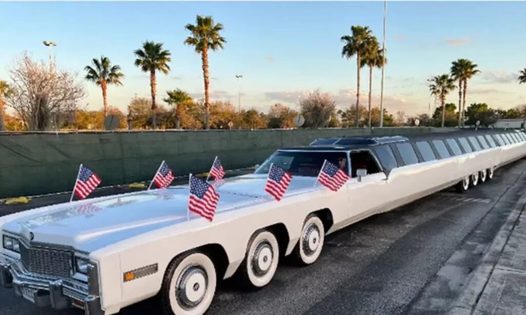 World’s longest limousine with swimming pool, helipad, and mini-golf area parked outdoors.