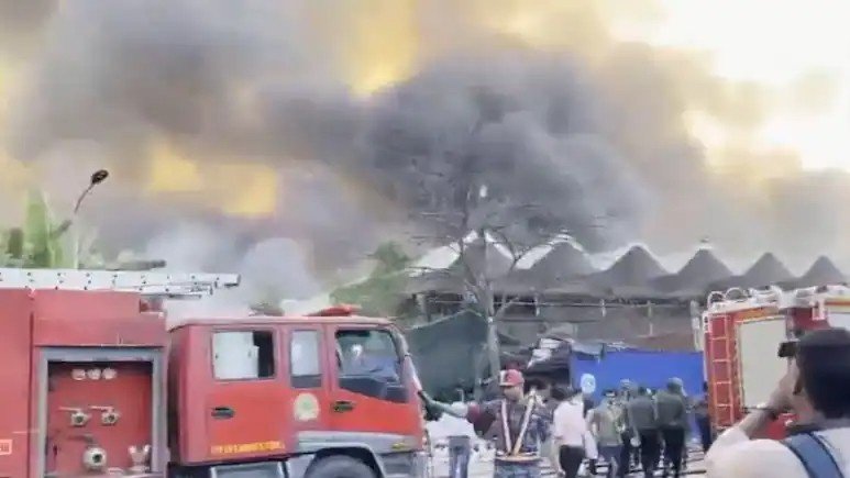 Fire at Hazrat Shahjalal International Airport cargo terminal in Dhaka with fire trucks and emergency response teams on site.