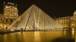 Louvre Museum Paris after jewelry heist investigation, French police arrest suspects.