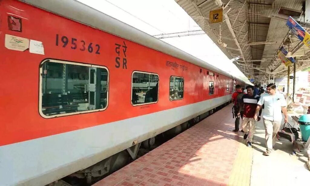 Amrit Express train arriving at a station with new route extended to Rameswaram.
