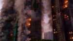 Fire engines and smoke at Wang Fuk residential tower in Hong Kong during a major fire accident.