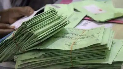 Election staff receiving postal ballot papers for Kerala local body polls.