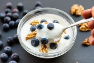 A bowl of plain yogurt highlighting the importance of choosing natural, low-sugar, probiotic-rich yogurt for better gut health.