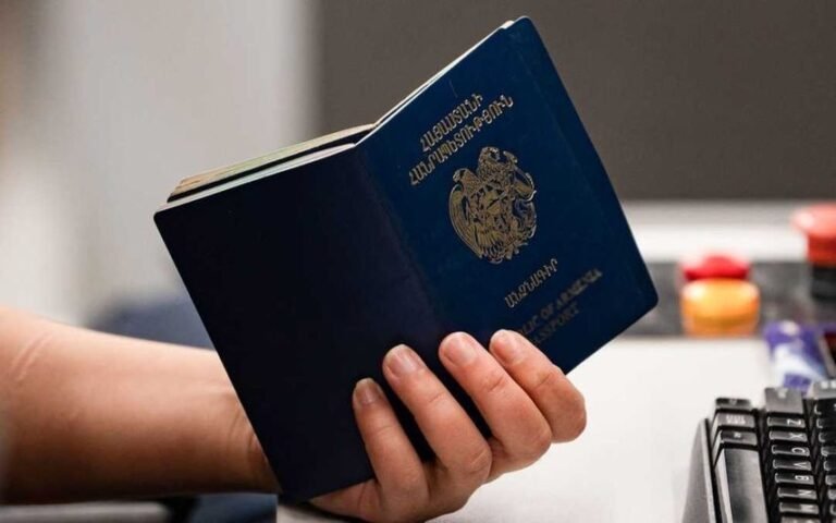 customs officers inspecting suspicious parcel containing drug-soaked papers.