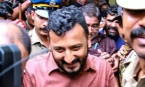 Kerala Police escorting Palakkad MLA Rahul Mamkootathil for court proceedings in the rape case.