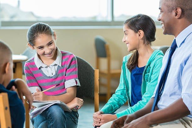 A symbolic image of a school counselor talking to a student in a Kerala government school environment.