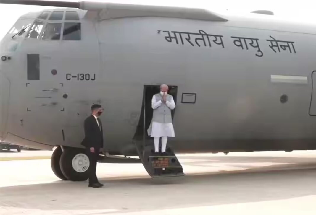 PM Narendra Modi exiting the C-130J Super Hercules aircraft on a newly inaugurated highway runway in Assam.