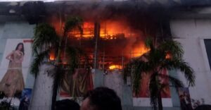 Fire scene investigation and police presence at Jayalakshmi Silks showroom in Kozhikode city.