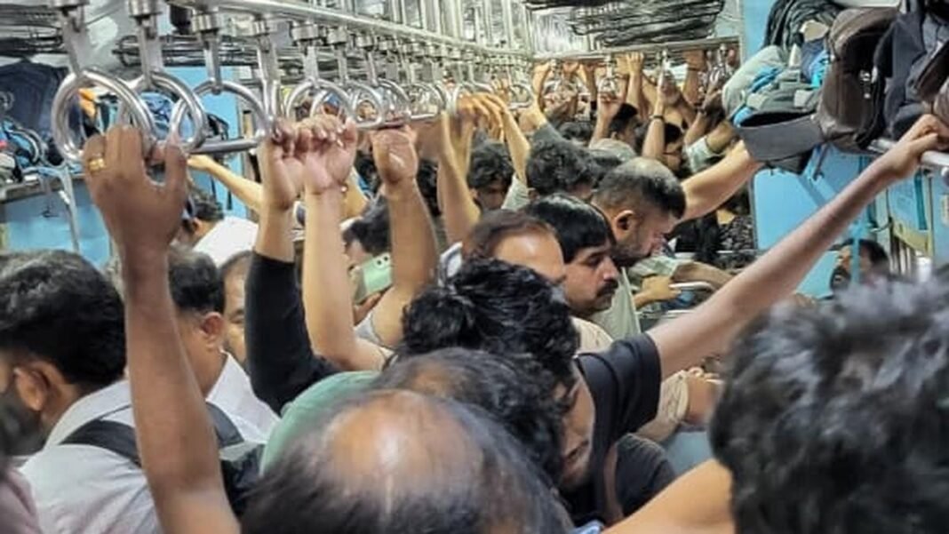 Crowded Palakkad-Ernakulam MEMU train arriving at a railway platform in Kerala