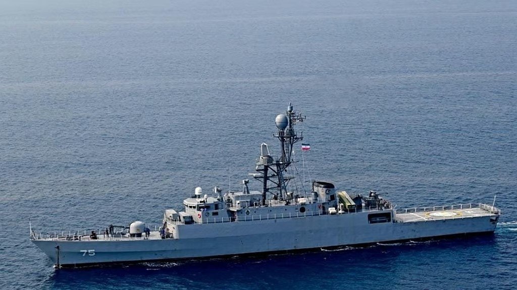 Graphic image showing Iranian Frigate IRIS Dena and naval tension map in Indian Ocean.