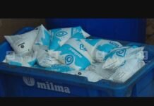 Fresh Milma milk packets stored correctly in a refrigerator tray during summer heat.