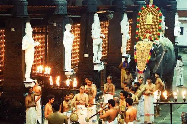 Lord Guruvayurappan's Golden Kolam carried by elephant Indrasen during the Pallivetta ceremony at Guruvayur.