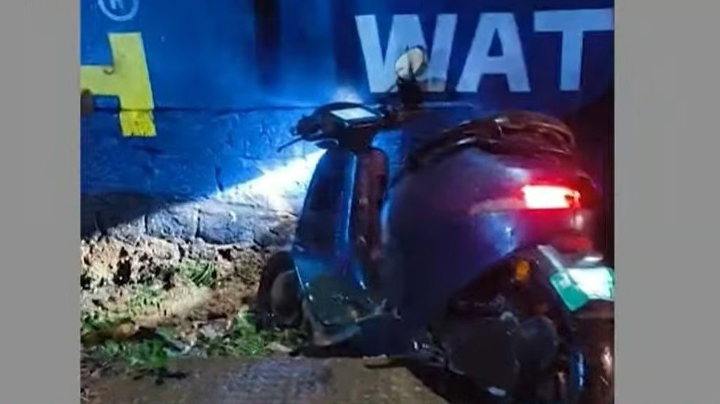 The damaged electric scooter at the accident site in Kuruvangad, Koyilandy.