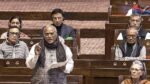 Mallikarjun Kharge delivering a humorous speech in Rajya Sabha while PM Narendra Modi and other MPs laugh.