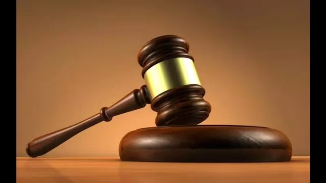 Legal gavel and scales representing the Tripura High Court's decision on family pension eligibility for daughters.