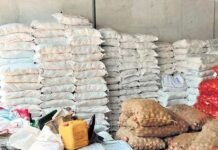 Police seizing food kits from a warehouse in Vadanappally, Thrissur during election period.