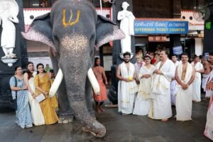 Devotee Deepak Narayanan offering elephant Krishnanarayanan to Guruvayur Devaswom officials during the Vishu festival.