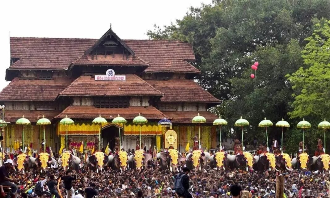 Decorative flags being hoisted at Thrissur temple marking the official start of Thrissur Pooram festival.
